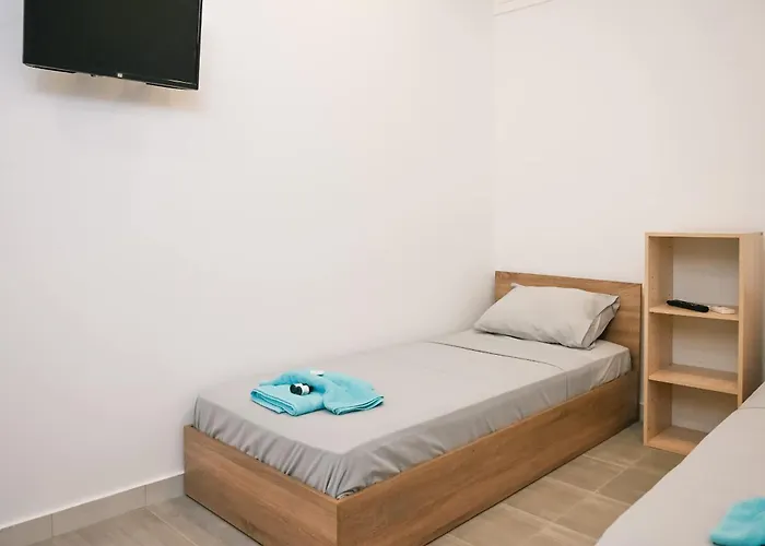 Santorini's Old Mill Serene Getaway By Pori Casa de Férias